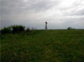 Хрест на горі на південь від села