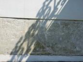 Надгробна плита, вмурована у західну…